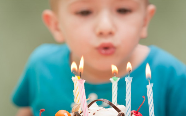 Boy Blowing Out Candles On A Birthday Cake Stock Photo, Picture and Royalty  Free Image. Image 3093210.