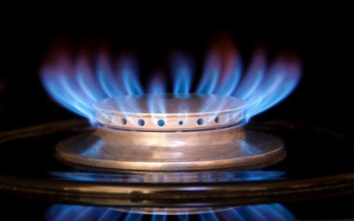 Natural gas burner and large orange and blue flame